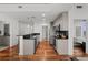 Modern kitchen featuring stainless steel appliances, black backsplash, and hardwood floors in an open-concept design at 1700 Bassett St # 1612, Denver, CO 80202