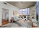 Well-lit living room with hardwood floors, floor-to-ceiling windows, and a view of the city skyline at 1700 Bassett St # 1612, Denver, CO 80202