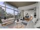 Spacious living room featuring a modern design, hardwood floors, and expansive city views through large windows at 1700 Bassett St # 1612, Denver, CO 80202