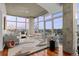 Bright and airy living room featuring concrete accents, expansive windows, and wood floors with city views at 1700 Bassett St # 1612, Denver, CO 80202