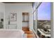 Spacious bedroom with a closet, a big window with city views, and modern décor at 1700 Bassett St # 1612, Denver, CO 80202