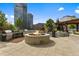 Relax on the spacious roof deck with an outdoor kitchen and a cozy fire pit lounge area at 1700 Bassett St # 1612, Denver, CO 80202