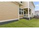 Features a cozy back porch and sliding glass doors for easy access and new black rain gutters at 245 Washington St, Erie, CO 80516