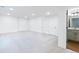 Finished basement with neutral carpet, recessed lighting, and an adjacent bathroom at 245 Washington St, Erie, CO 80516