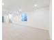 Large basement space with recessed lighting and access to stairs and window at 245 Washington St, Erie, CO 80516