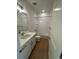 Bright bathroom with tiled shower and ample vanity space at 245 Washington St, Erie, CO 80516