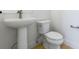 Clean bathroom with pedestal sink and standard toilet at 245 Washington St, Erie, CO 80516