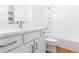Bright bathroom with tub-shower, white vanity, and light countertop at 245 Washington St, Erie, CO 80516