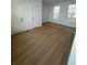 Bright bedroom with wood flooring and two windows at 245 Washington St, Erie, CO 80516