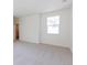 Bright bedroom with neutral carpet and a big window at 245 Washington St, Erie, CO 80516