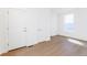 Clean and bright bedroom with laminate flooring and ample closet space at 245 Washington St, Erie, CO 80516