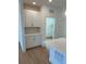 A modern kitchen with white cabinets and a stylish backsplash at 245 Washington St, Erie, CO 80516