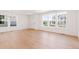 Bright and airy living room featuring hardwood floors, recessed lights, and large windows at 245 Washington St, Erie, CO 80516