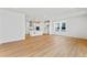 Bright and airy living room with hardwood floors, recessed lights, and a modern open-concept design at 245 Washington St, Erie, CO 80516