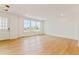 Bright and airy living room featuring hardwood floors, recessed lights, and large windows at 245 Washington St, Erie, CO 80516