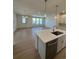 Bright living space with a kitchen island and a large sliding glass door at 245 Washington St, Erie, CO 80516