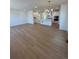 Open-concept living room and kitchen with hardwood floors and recessed lighting at 245 Washington St, Erie, CO 80516