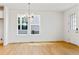 Bright and airy living room with great windows, featuring hardwood floors and recessed lights at 245 Washington St, Erie, CO 80516