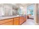 Spacious bathroom features dual vanities with granite countertops and a glass-enclosed shower for a luxurious feel at 19755 W 57Th Cir, Golden, CO 80403