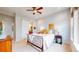 Stylish bedroom features a sliding barn door to the bathroom, creating a modern and functional space at 19755 W 57Th Cir, Golden, CO 80403