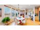 Cozy dining room with a view, featuring a round table and rustic chandelier at 19755 W 57Th Cir, Golden, CO 80403