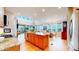 Open kitchen with granite counters, an island with seating, and stainless steel appliances at 19755 W 57Th Cir, Golden, CO 80403