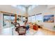 Bright living room with high ceilings, stylish furnishings, and a sliding glass door at 19755 W 57Th Cir, Golden, CO 80403
