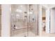 Modern shower features sleek tilework, built-in bench, and glass enclosure for a spa-like experience at 19755 W 57Th Cir, Golden, CO 80403