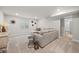 Cozy basement living area with a comfortable sectional sofa, plush carpeting, and modern decor at 5108 N Quatar St, Aurora, CO 80019