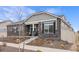 Charming single-Gathering home with stone accents, a cozy front porch, and professionally landscaped yard at 5108 N Quatar St, Aurora, CO 80019