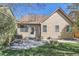 Backyard patio features an outdoor grill, table set, and landscaped areas with lush lawn at 11332 E 111Th Ave, Commerce City, CO 80640
