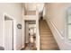 Bright foyer features soaring ceilings, staircase, and hardwood floors visible in background at 11332 E 111Th Ave, Commerce City, CO 80640