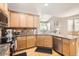 Modern kitchen featuring hardwood floors, granite countertops, stainless steel appliances and abundant cabinet space at 11332 E 111Th Ave, Commerce City, CO 80640