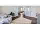 Open living room showcasing stylish furniture, a patterned rug, and an abundance of natural light at 5490 Suffolk Ave, Castle Rock, CO 80104
