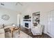 Bright living room features hardwood floors, vaulted ceilings, lots of windows, and a cozy fireplace at 5490 Suffolk Ave, Castle Rock, CO 80104