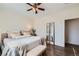 Relaxing main bedroom featuring a queen-size bed, soft textiles, and a ceiling fan at 5490 Suffolk Ave, Castle Rock, CO 80104
