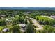 Aerial shot of a home nestled in a lush neighborhood surrounded by mature trees and greenery at 8836 Marathon Rd, Longmont, CO 80503