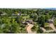 Aerial view of a home in a tree-filled neighborhood, showcasing the property's setting and surroundings at 8836 Marathon Rd, Longmont, CO 80503