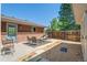 Backyard patio ideal for outdoor gatherings with stylish seating and mature trees at 8836 Marathon Rd, Longmont, CO 80503