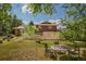 Enjoy the outdoors on the backyard patio surrounded by beautiful trees, well-maintained lawn, and privacy fence at 8836 Marathon Rd, Longmont, CO 80503