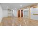 Finished basement area boasting storage shelves and neutral carpeted stairs at 8836 Marathon Rd, Longmont, CO 80503