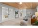 Spacious basement featuring a bar area, comfortable seating, and access to additional rooms at 8836 Marathon Rd, Longmont, CO 80503