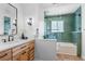 Updated bathroom showcasing a sleek vanity, modern lighting, and a stylish tiled shower at 8836 Marathon Rd, Longmont, CO 80503