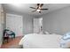 Comfortable bedroom with a ceiling fan, large closet, and cozy decor at 8836 Marathon Rd, Longmont, CO 80503