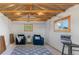 Bright bonus room with natural light and cozy seating at 8836 Marathon Rd, Longmont, CO 80503