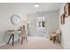Bright home office with a modern desk, stylish decor, and a view to the sunroom at 8836 Marathon Rd, Longmont, CO 80503