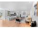 Open-concept living space with a modern kitchen, hardwood floors, and comfortable seating area, creating an inviting atmosphere at 8836 Marathon Rd, Longmont, CO 80503