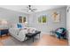 Serene main bedroom featuring two windows, ceiling fan, and cozy decor at 8836 Marathon Rd, Longmont, CO 80503