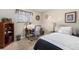 Cozy bedroom with a desk, chair, and a bookshelf, perfect for a home office at 9731 W Polk Dr, Littleton, CO 80123