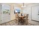 Charming kitchen with breakfast nook and a wooden table set for four at 9731 W Polk Dr, Littleton, CO 80123